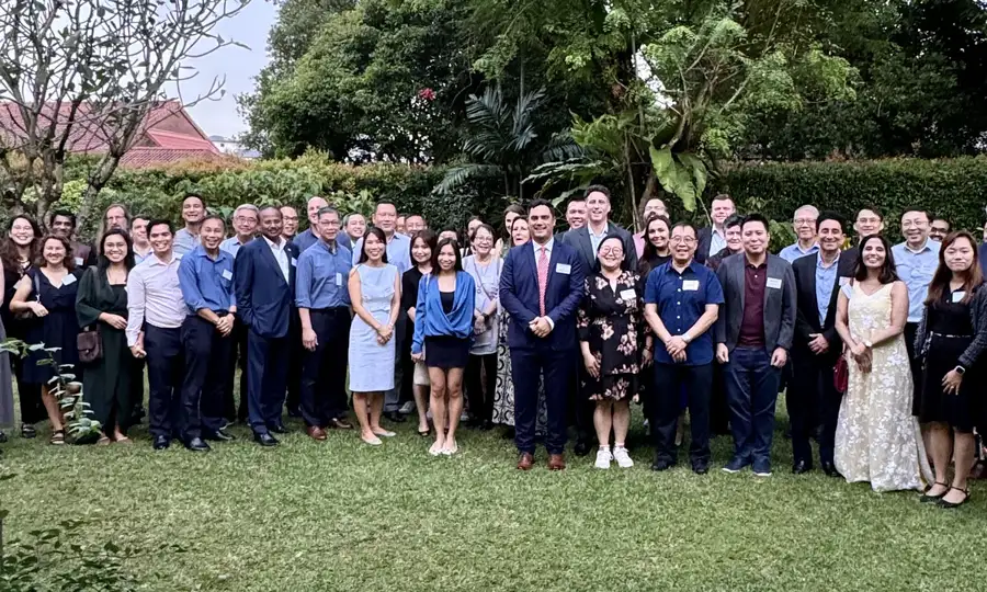 Massey alumni gathered outside with new students in Singapore.