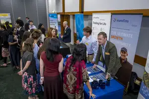 Massey alumnus Nathan Pollard speaking with students at the Agriculture Awards careers expo.