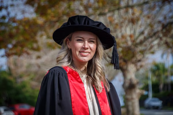 A woman wearing academic regalia