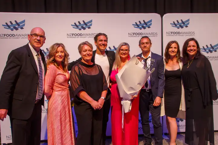 Pantry Award 2024 winners in front of NZFA banner.