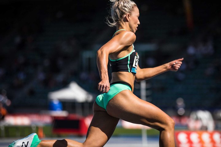 Olivia Eaton running on a track