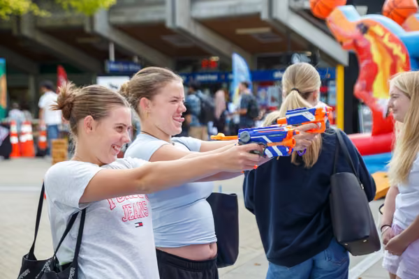 Students at orientation enjoy carnival games