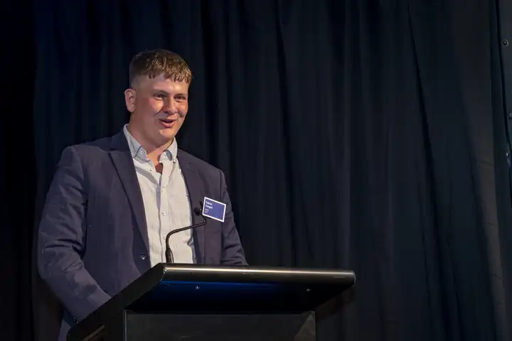 Patrick Coogan speaking at the podium during the Massey Agriculture Awards.