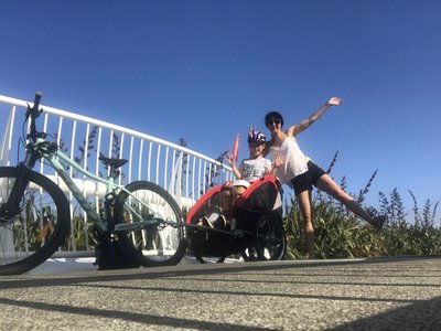 Rhia Robb with her three children on bikes