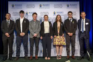 group of winners standing together