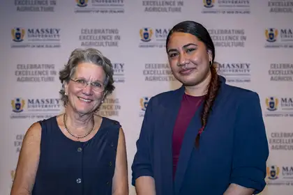 two women smiling at awards evening