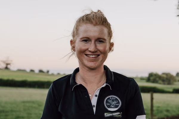 country woman outside smiling at camera