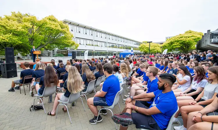 Large group of seated students attending orientation