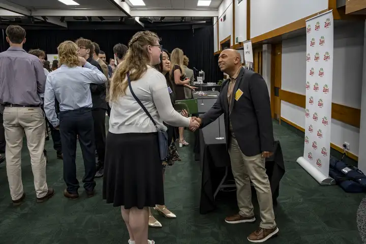 Students shaking hands and networking with Zespri representative Agam Nangui at the 2026 Agriculture Awards careers expo.