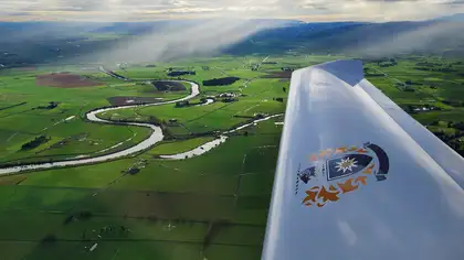 Plane wing with countryside in background