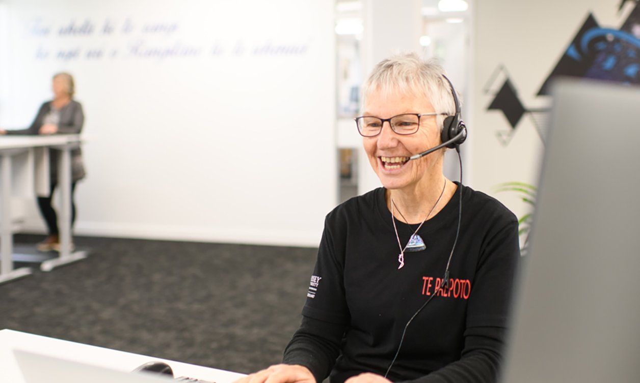 Te Paepoto staff member on phone call with customer
