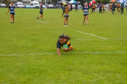 girl scoring a rugby try