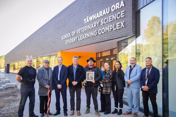 Representatives from Rangitāne, Massey and the construction team outside the new building.