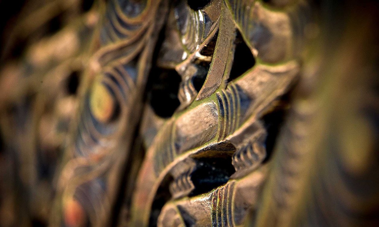Close-up of a brown traditional Māori wood carving
