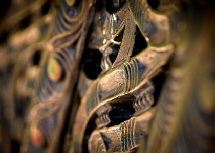 Close-up of a brown traditional Māori wood carving