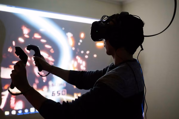 Person using a VR headset and controllers