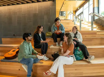 Small group of students sitting talking
