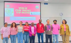 Staff wearing pink shirts during a Green Impact Pink Shirt Day event