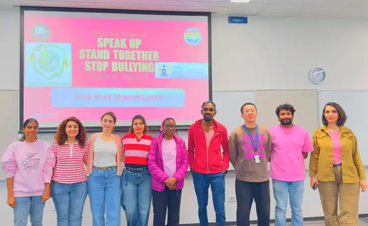 Staff wearing pink shirts during a Green Impact Pink Shirt Day event
