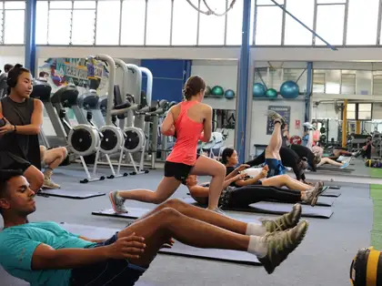 People working out during group training class