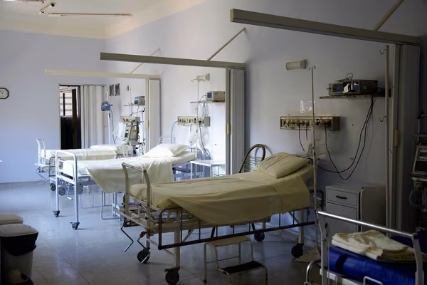 room with three hospital beds
