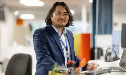 Person standing at their desk during work