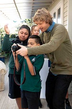 Teacher Paascalino Schaller with students at AIS.