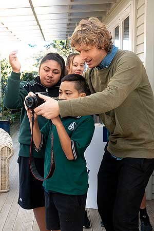 Teacher Paascalino Schaller with students at AIS.