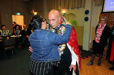 James Cherrington receives a congratulatory hug at the Pacific Graduation Celebration in May 2021