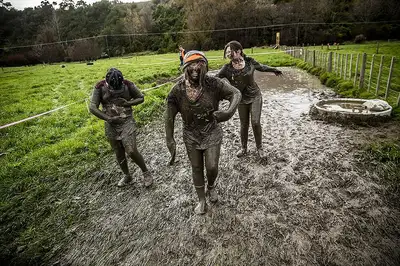 Muddy runners during the Tough Guy and Gal Challenge