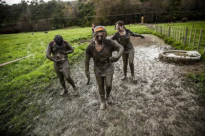 Muddy runners during the Tough Guy and Gal Challenge