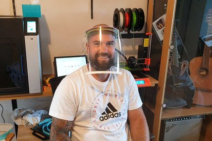 Sean Rasmussen in a face shield