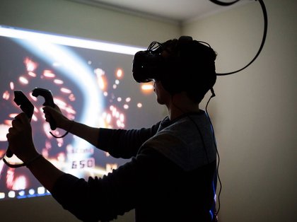 A student using virtual reality (VR) equipment
