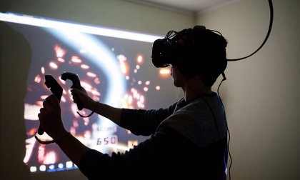 A student using virtual reality (VR) equipment