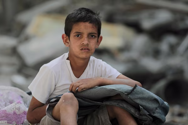 Boy looks at the camera in war torn Gaza. Photo credit: Hosnysalah via Pixabay.